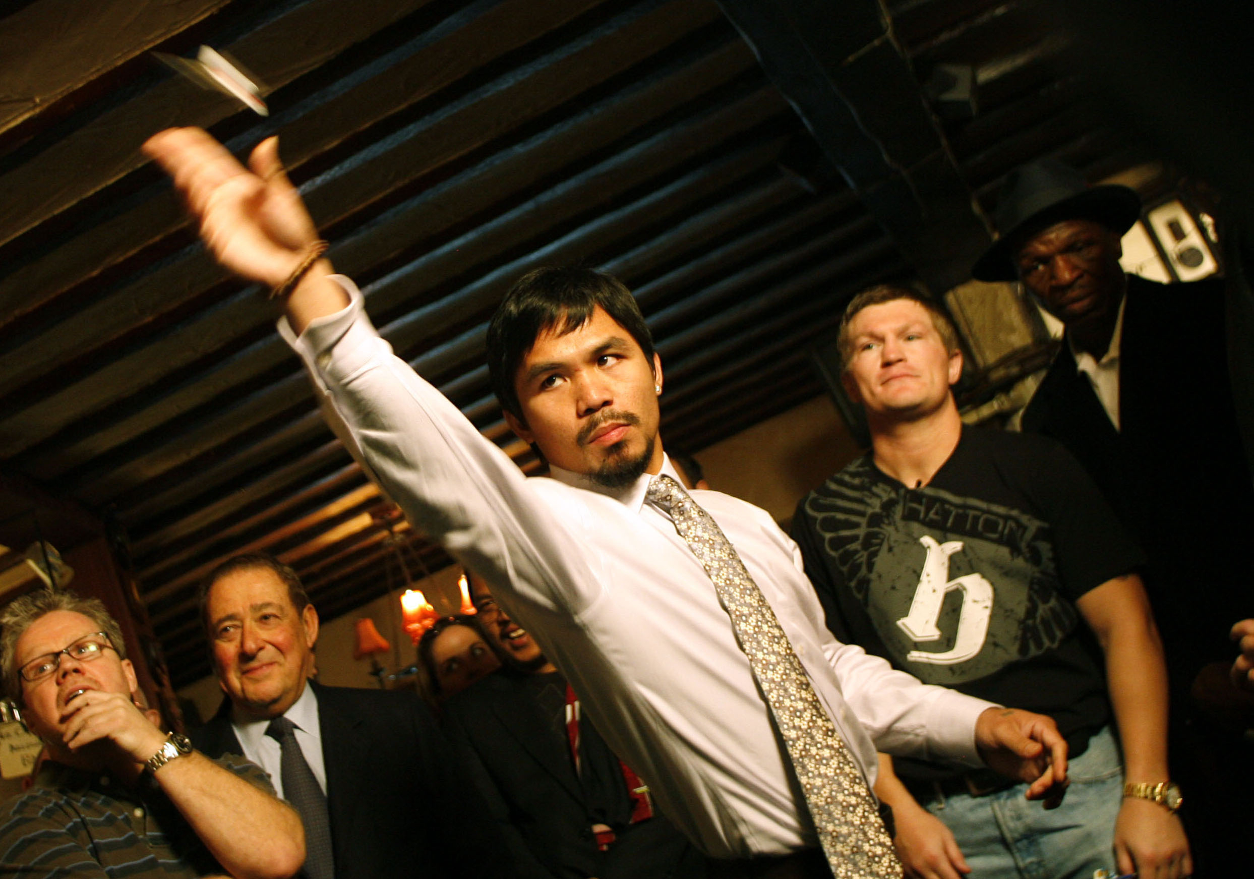 Manny Pacquiao and Ricky Hatton playing darts.