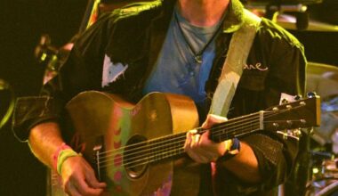 Chris Martin has revealed why his band Coldplay are keeping the kiss cam at their stadium shows, after it caused a scandal last month; Martin pictured at Glastonbury last year