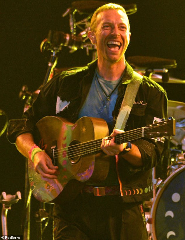 Chris Martin has revealed why his band Coldplay are keeping the kiss cam at their stadium shows, after it caused a scandal last month; Martin pictured at Glastonbury last year