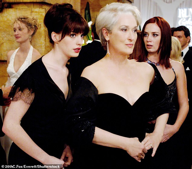 Emily and Anne Hathaway (left) are pictured in the 2006 first movie as Emily Charlton and Andrea Sachs, employees of Meryl Streep's fearsome fashion editor Miranda Priestley (center)