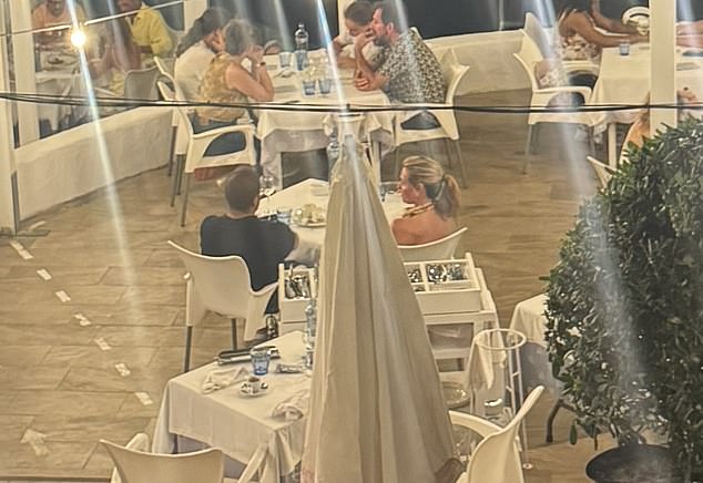 In pictures obtained exclusively by The Daily Mail, the This Morning host, 48, was snapped on a dinner date at a restaurant in Sitges, frequently visited by celebrities, minus her wedding ring