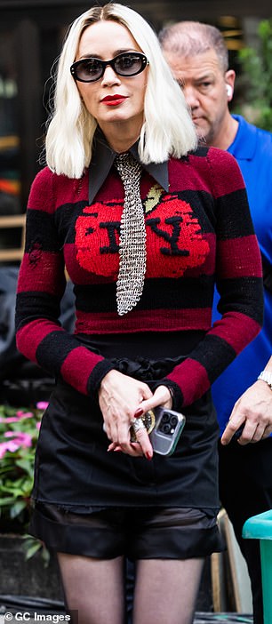 She pulled a high-waisted black skirt over a set of matching shorts, which were cut revealingly enough to show off her vertiginous legs