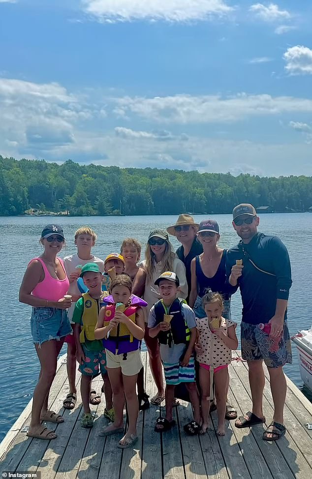 There was also a portrait with her kids and friends on a wood dock