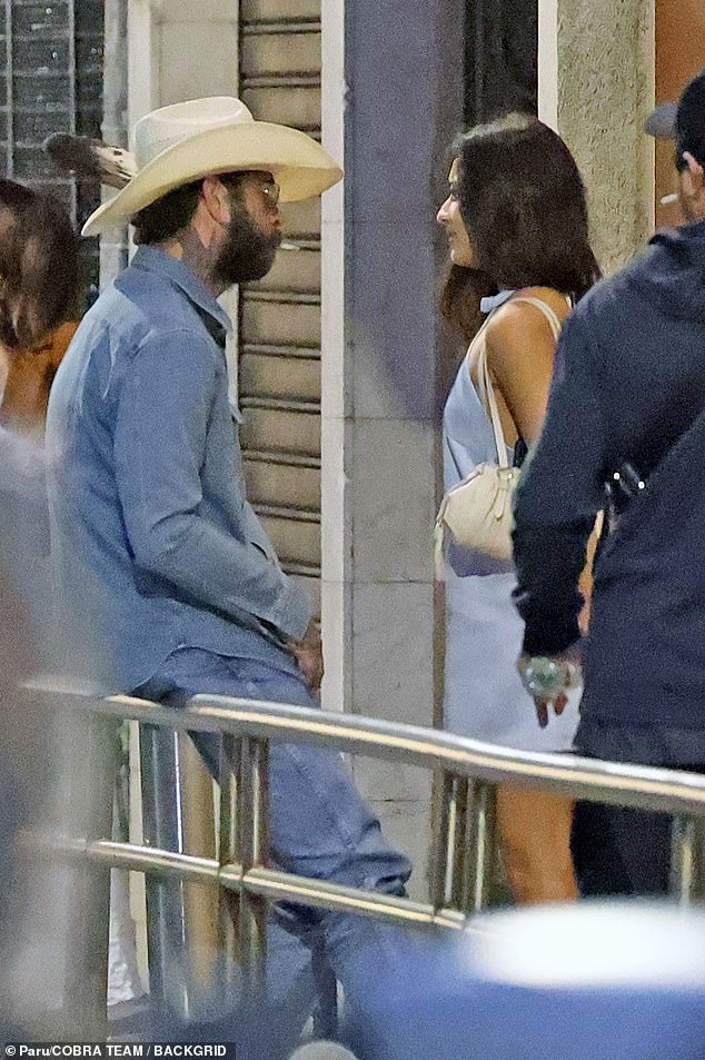 Their eyes locked as they strolled through the city