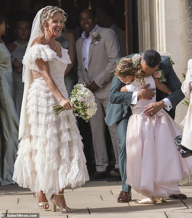 Mark shared a sweet moment with their daughter Nancy following the ceremony