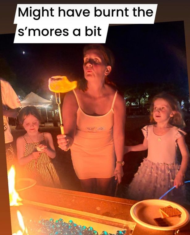 Sue also wore the figure hugging minidress while making s'mores with her kids