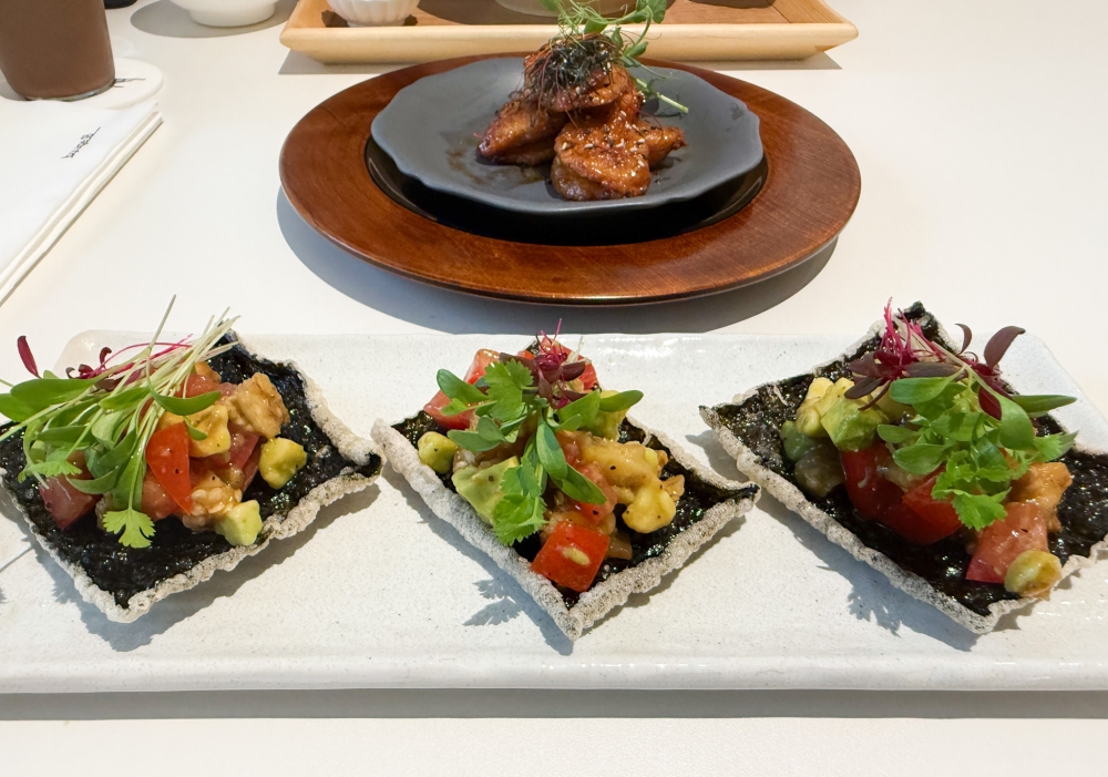 Avocado Tartare on Seaweed Crisps (front) starts a meal with an appetising crunch while the Teriyaki Lion's Mane Mushroom (back) offers a hearty bite. — Picture by Lee Khang Yi