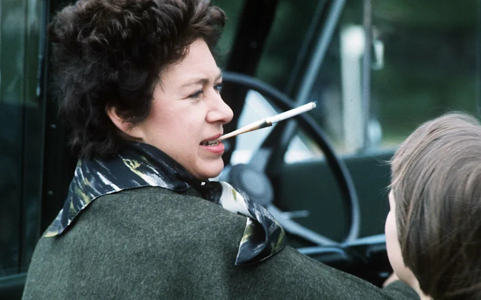Princess Margaret smokes a cigarette as she attends the Windsor Horse Show in 1978