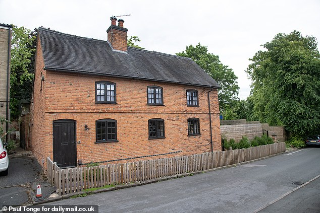 Matt Hubbard has lost his battle with the council and been ordered to lower the 'hideous' and 'ugly' eight-foot-high fence he built at his grade II listed home
