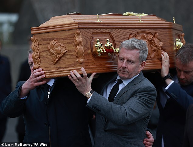 Confirmation of their separation came five months after Cat's no-show at the funeral of Patrick's beloved late mother Mary which, as The Daily Mail revealed last week, left members of his close-knit family 'seething.' Pictured: Patrick carries his mother's coffin at her funeral