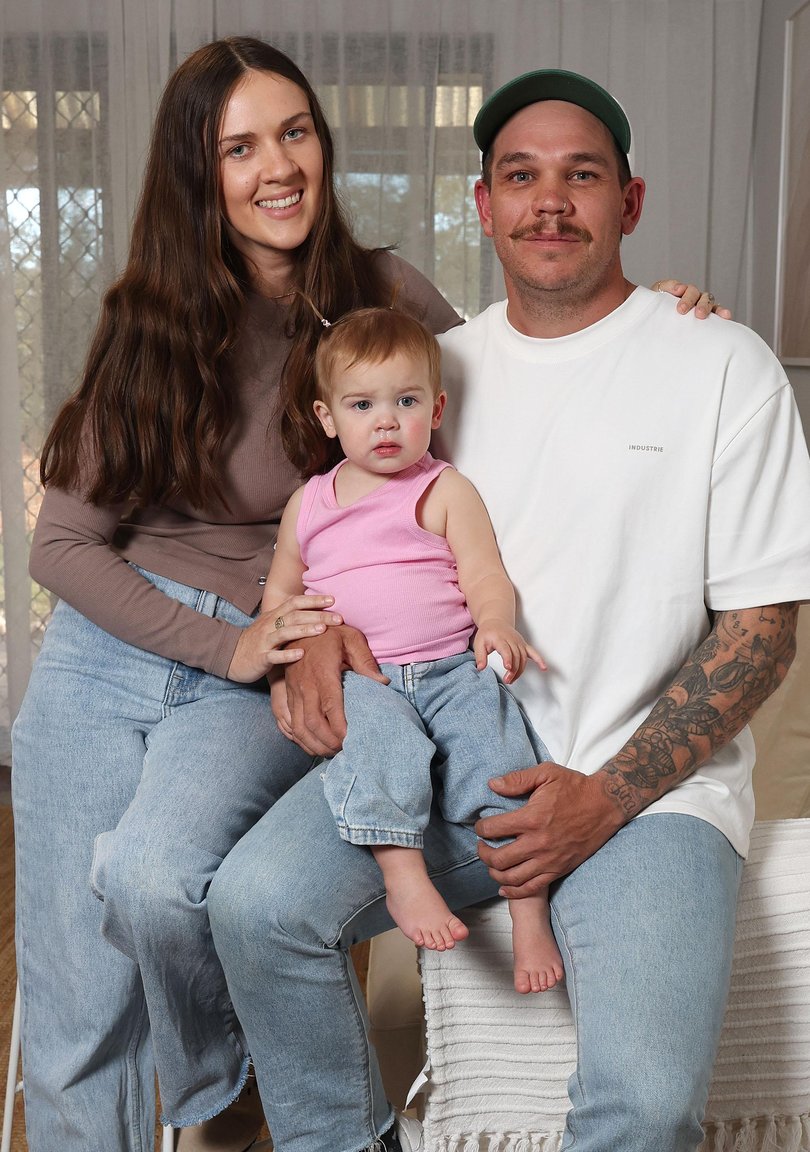 Harper Mitsopoulos (20 months) pictured with her parents Bronte and Kyle at home in Willagee.