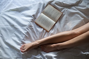 Book by female legs