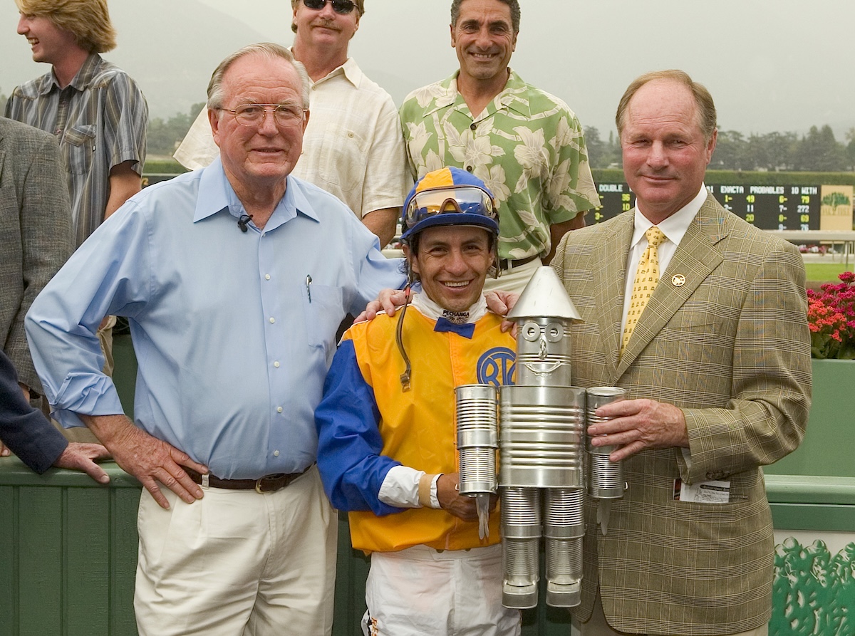 Ralph Todd, Victor Espinoza, and Richard Mandella with a most appropriate trophy. (Benoit photo)