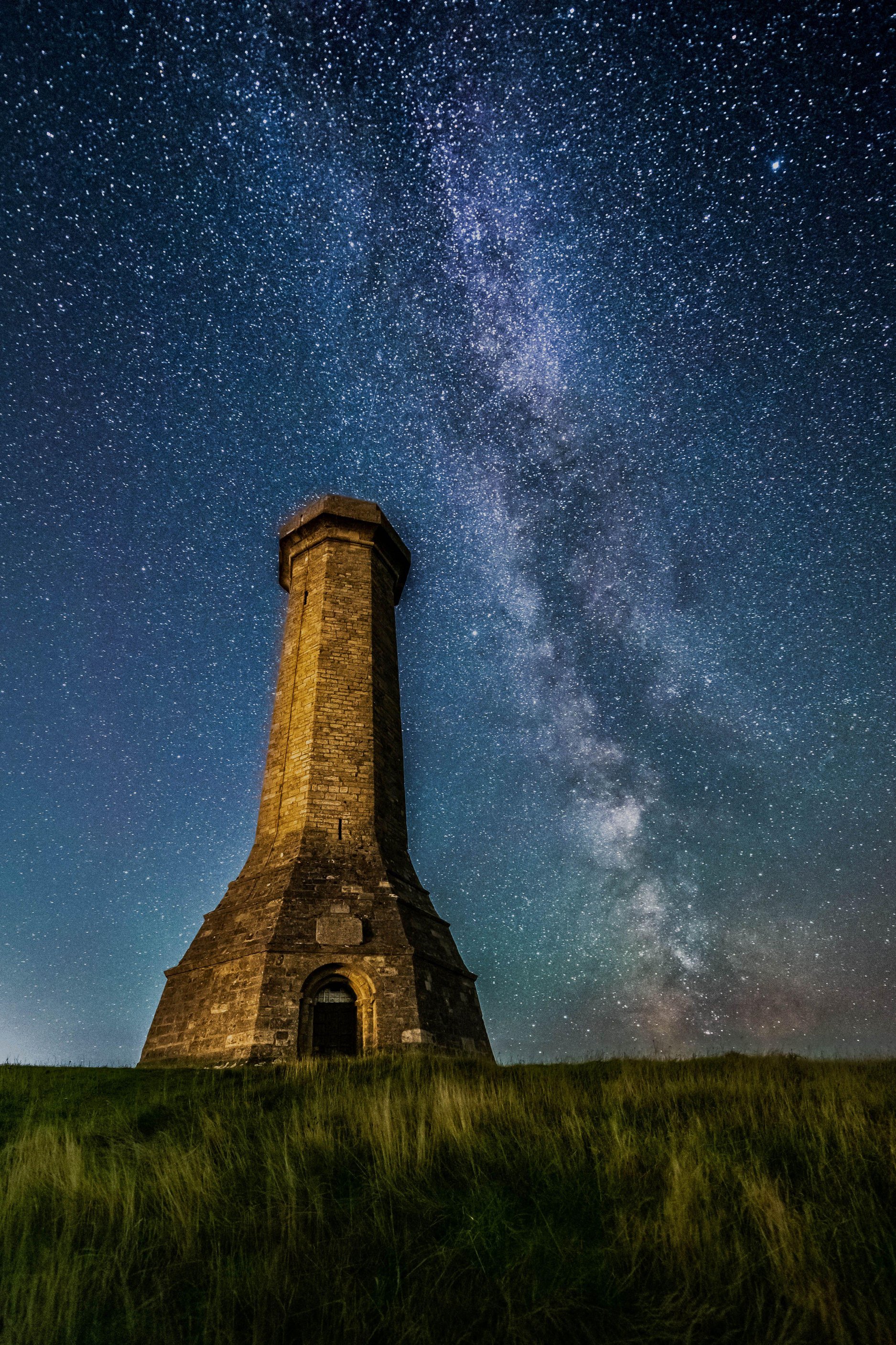 Portesham, Dorset, UK. 25th September 2025. UK Weather: The stars of the Milky Way glow brightly in the clear night sky above Hardy Monuments at Portesham in Dorset. The telescope shaped monument was built in 1844 in memory of Vice-Admiral Sir Tho