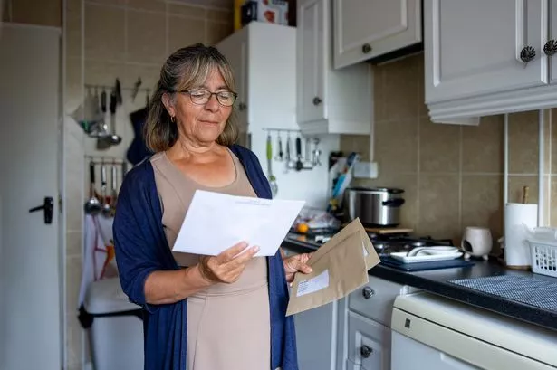 Older woman reading letter