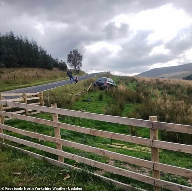 A car pictured in a ditch after it collided with the Widdale Bridge Bell in the Yorkshire Dales
