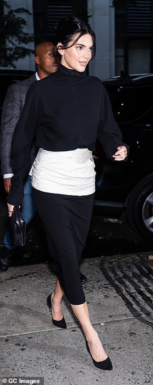 Also at the event was Gigi's close friend Kendall, 29, who also looked stylish in a black jumper and skirt with a thick white band that accentuated her slender waist