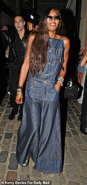 Naomi looked effortlessly stylish in Levis' denim maxi dress that boasted a quirky bodice which she wore with comfy trainers