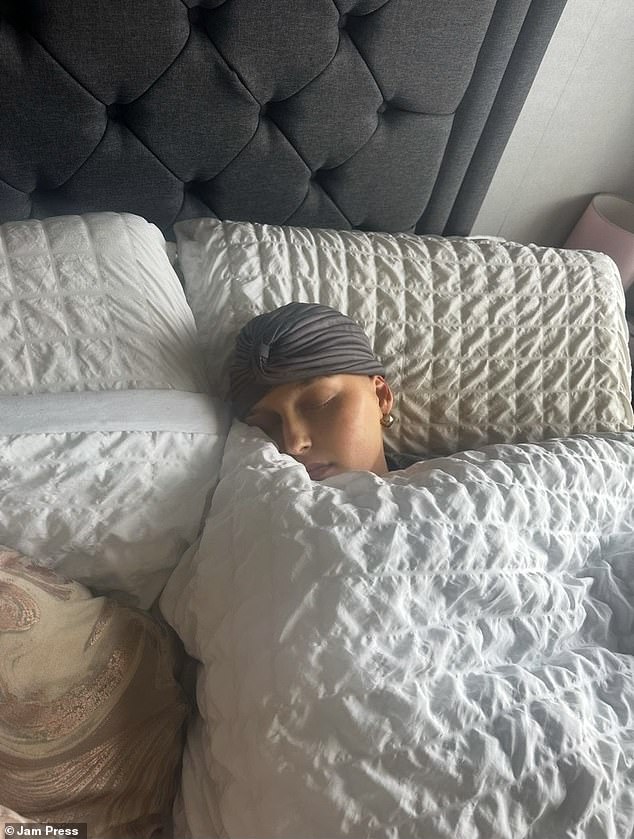 Ms Kalkan in bed after receiving treatment for the cancer which doctors dismissed as sciatica