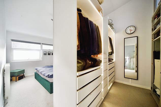The carpeted master bedroom has enough room for a double bed, fitted wardrobe and storage space
