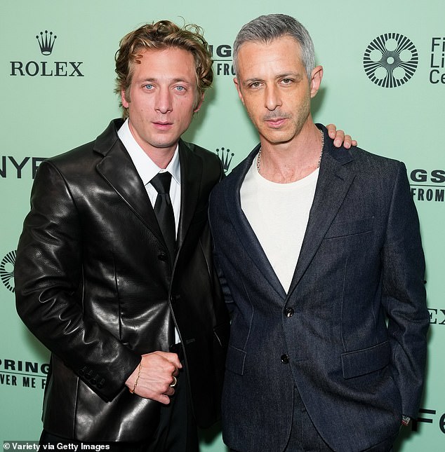 The movie is directed by Scott Cooper and also features Succession star Jeremy Strong (pictured with White) as Springsteen’s longtime manager and co-producer Jon Landau