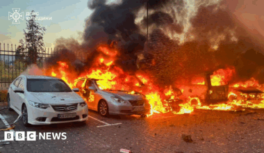 Vehicles are burning in Ukraine's Kyiv region following an overnight Russian aerial attack