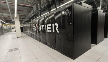 The Frontier supercomputer at ORNL is pictured as several rows of black cabinets