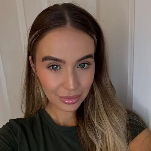 Kimberlie Smith Kimberlie Smith with long brown hair looking straight into camera