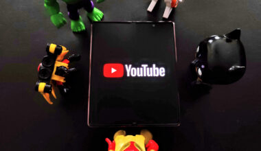 YouTube on Galaxy Z Fold 2 with toys around it