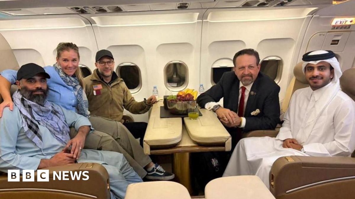 Amir Amiri, who had been detained in Afghanistan since December 2024, poses for a picture alongside Adam Boehler, the U.S. special envoy for hostage response, Sebastian Gorka, the deputy assistant to the U.S. president and senior director for counterterrorism, and a Qatari diplomat, on a plane from Kabul Afghanistan, September 28, 2025.
