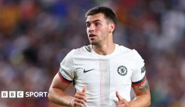 Marc Guiu looks on in a Chelsea shirt