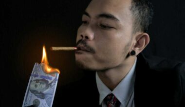 Man Lighting His Cigarette with Burning Bank Note