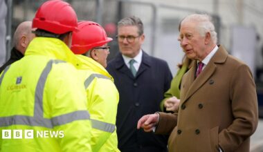 King Charles III, accompanied by Prime Minister Sir Keir Starmer, speak to construction workers at 'Phase 8A', the next building phase of Nansledan, as they walk to the Kew An Lergh development, a home to a diverse range of businesses, in Newquay