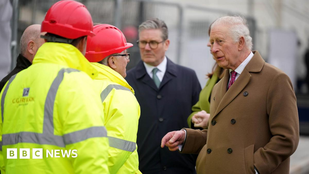 King Charles III, accompanied by Prime Minister Sir Keir Starmer, speak to construction workers at 'Phase 8A', the next building phase of Nansledan, as they walk to the Kew An Lergh development, a home to a diverse range of businesses, in Newquay