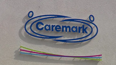 Caremark's logo on the side of a building.