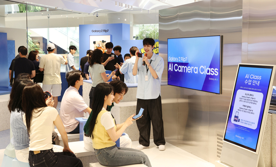 Visitors experience Galaxy Z Fold 7 and Flip 7 at an experience zone at The Hyundai Seoul, western Seoul, on July 13. [SAMSUNG ELECTRONICS]