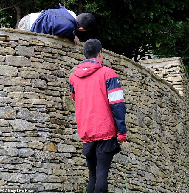 In fact, selfie-hunting tourists have previously been pictured climbing over walls and vaulting garden fences in Bibury (pictured) in a bid to get the perfect picture