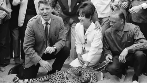Getty Images Cardinale (C) alongside actor Burt Lancaster (L) in a presentation of the Visconti’s ‘The Leopard’, 1963.