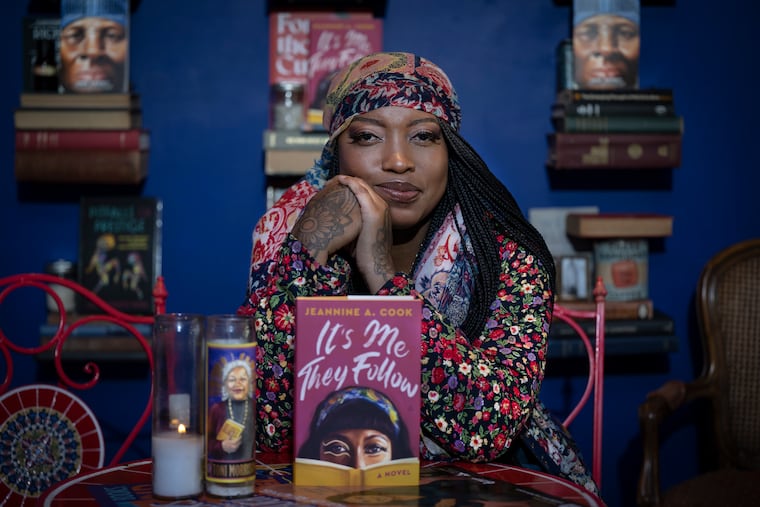 Author Jeannine Cook with her book at the newly refurbished Harriett's Bookshop in Philadelphia.