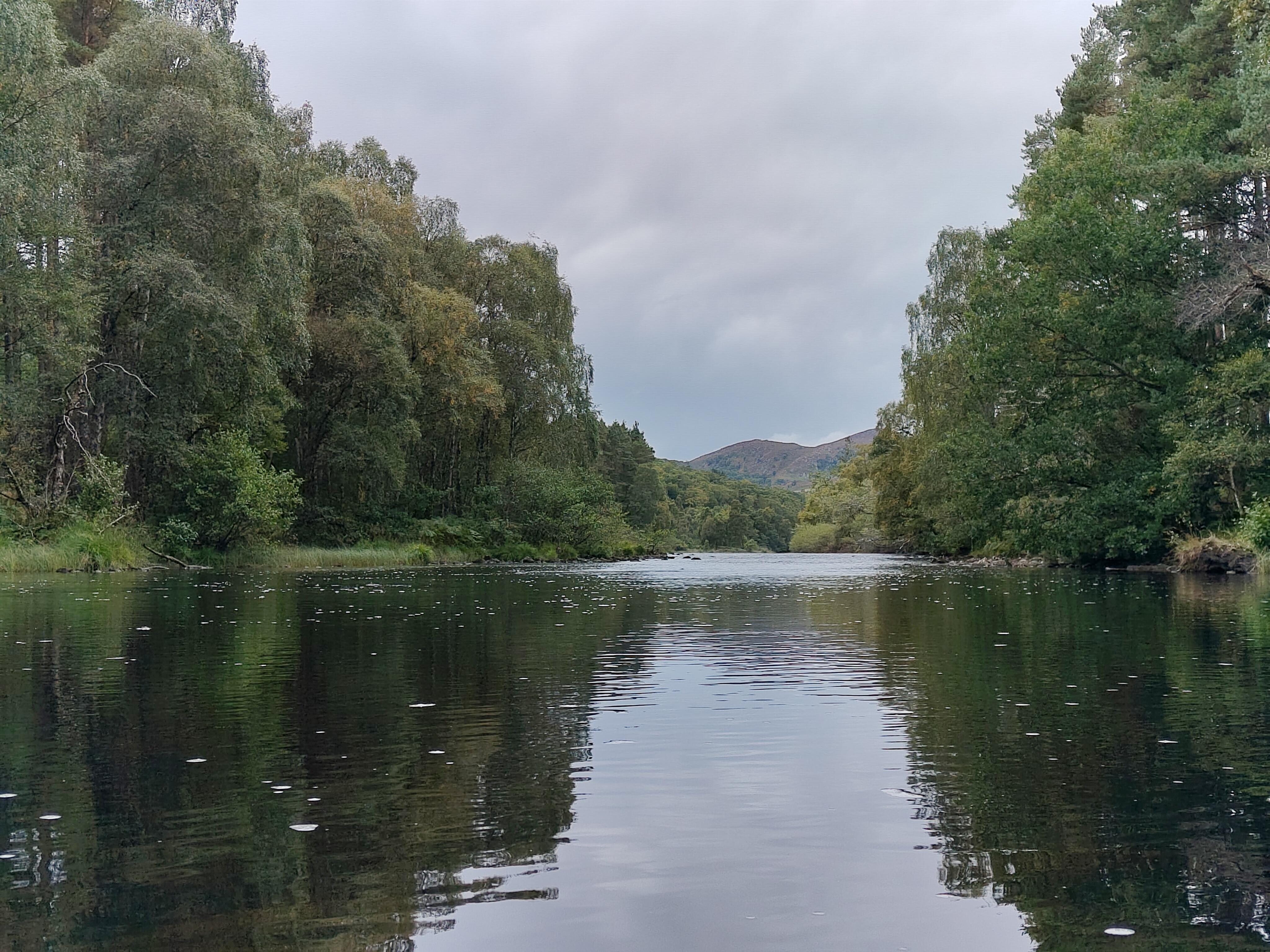 A camera sample taken on the Fairphone 6 showing a river with a mountain in the background.