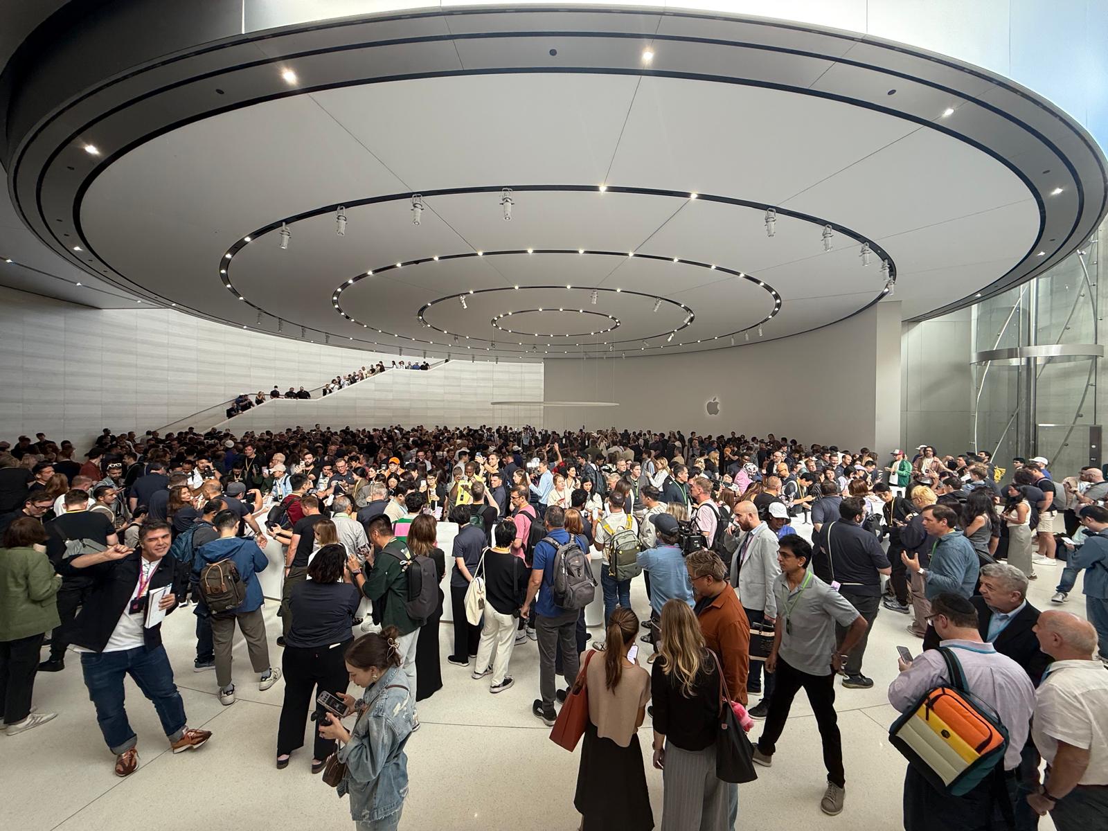A crowd of people inside a building at Apple Park
