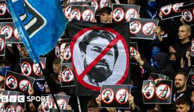 Russell Martin and Nico Raskin embrace as the midfielder is substituted