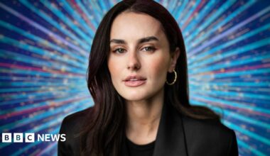 Amber Davies in a black suit