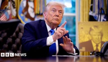 President Donald Trump takes a question from a reporter before signing executive orders in the Oval Office at the White House on September 19, 2025 in Washington, DC. Trump signed two executive orders, establishing the "Trump Gold Card" and introducing a $100,000 fee for H-1B visas.