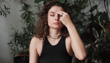 Woman pressing her forehead to ease her anxiety