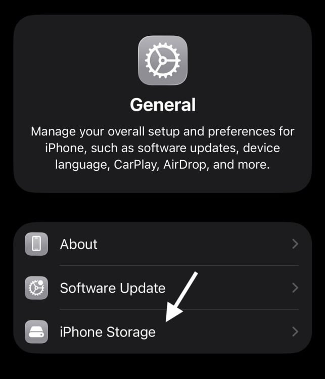 iPhone general settings screen with an arrow pointing to iPhone Storage