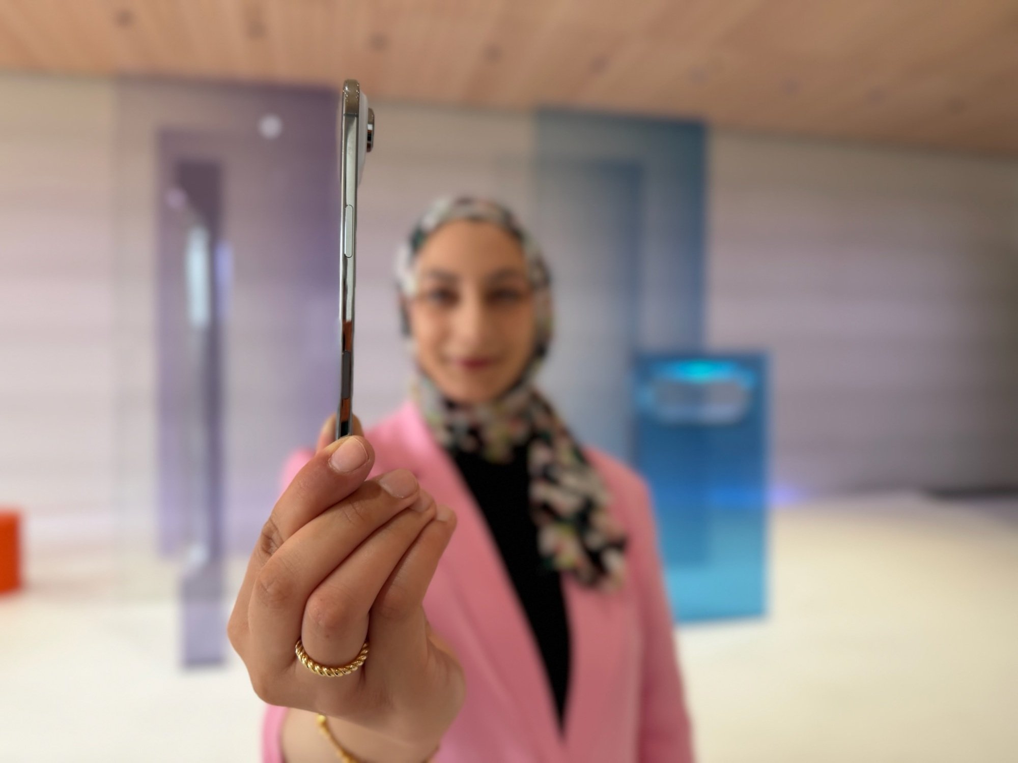 CNET reporter Abrar Al-Heeti holds the iPhone Air