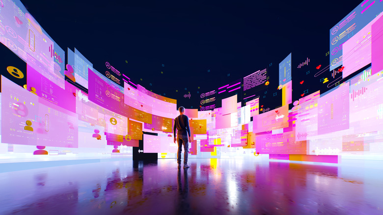 Digital generated image of a man in empty black space surrounded by multicoloured semi transparent data screens.