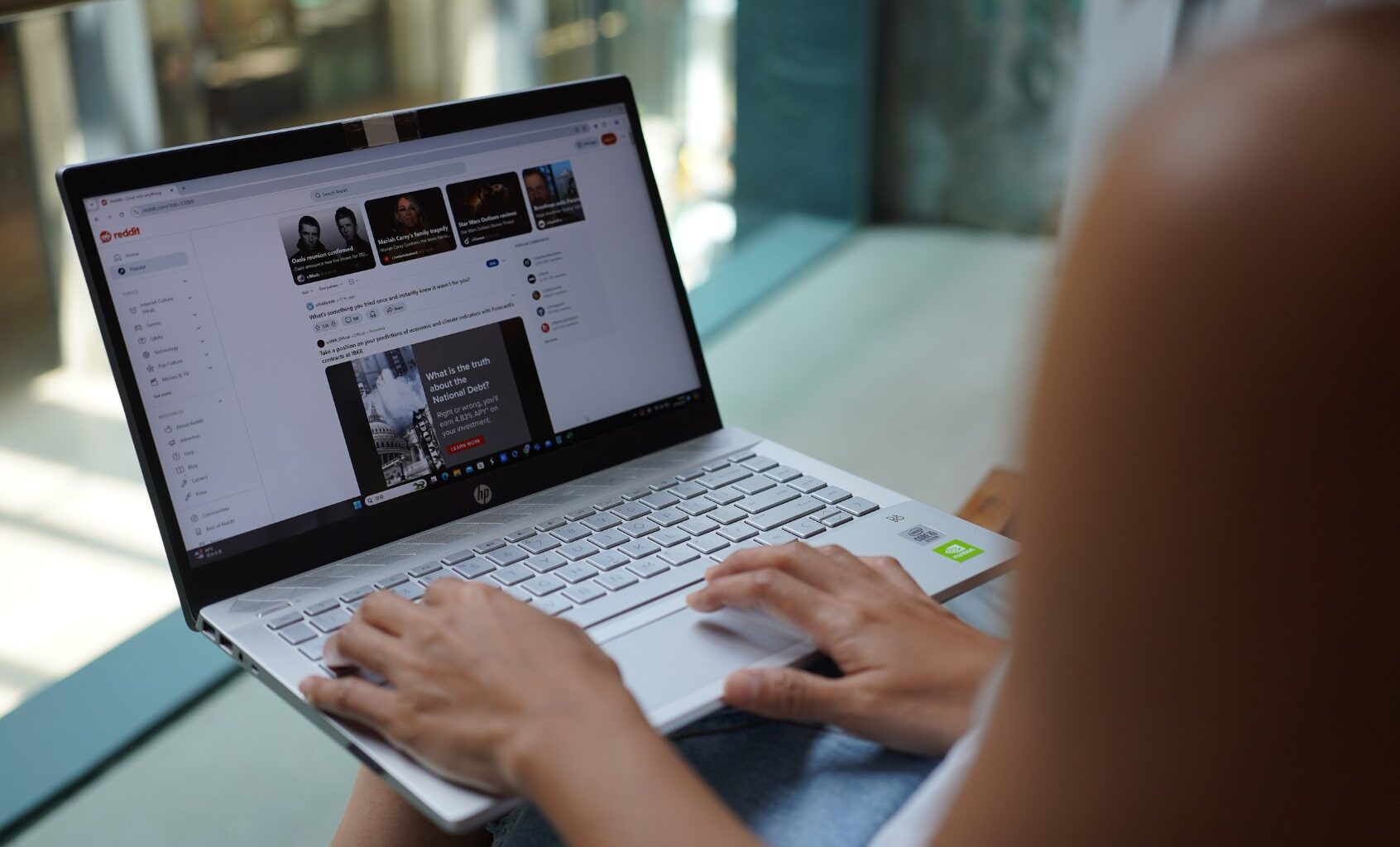In this photo illustration, a woman browses Reddit website on her laptop. (Photo Illustration by Serene Lee/SOPA Images/LightRocket via Getty Images)