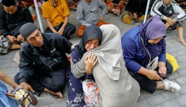 Relatives wait to hear news of their loved ones. Pic: Reuters.